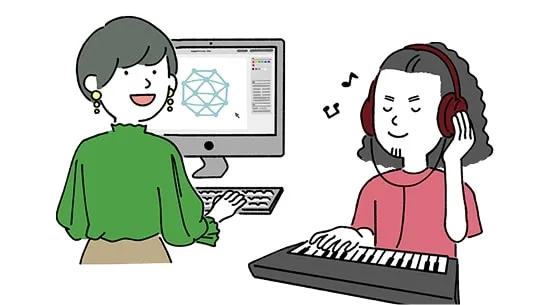 学生たちがゲーム制作スタジオでパソコン作業をしている様子