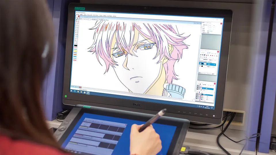 専用ソフトを使って作画をする学生