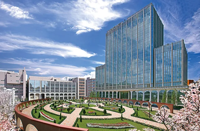 全面ガラス張りの高層ビルと円形デザインの庭園