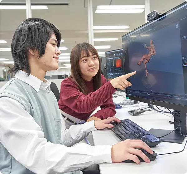 ２名の学生がパソコンの３Dグラフィックを見ている様子
